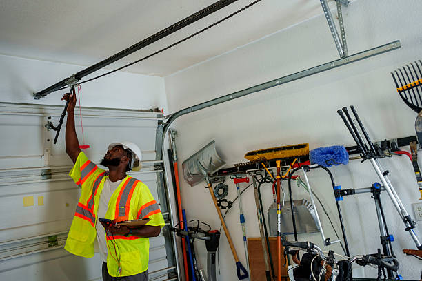 Professional Garage Door Installation technician working in East Cleveland, OH